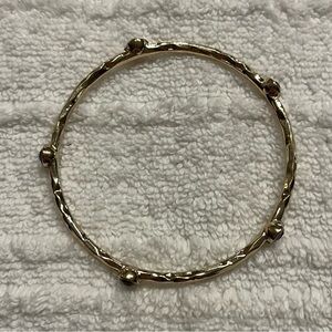 Gold tone bangle bracelet. Purple accents. Layer!  Simple.